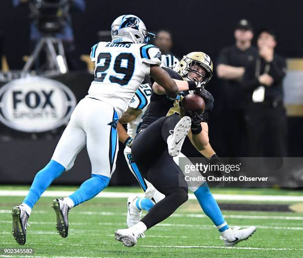 New Orleans Saints tight end Josh Hill makes a reception between Carolina Panthers free safety Kurt Coleman and strong safety Mike Adams during the...
