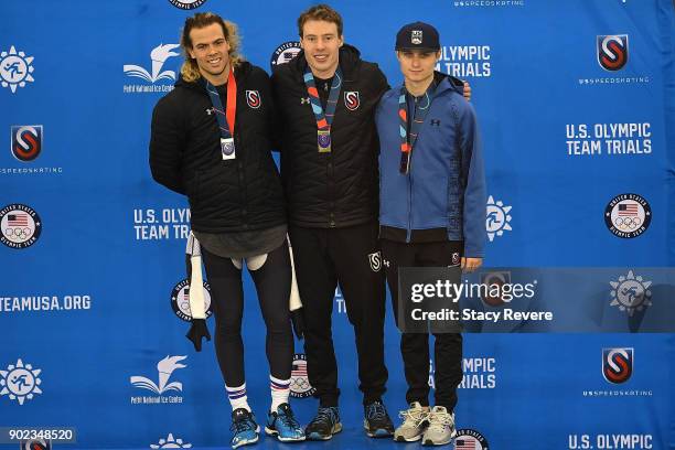 Jeffrey Swider-Peltz, Brian Hansen and Ian Quinn stand on the podium during the Long Track Speed Skating Olympic Trials at the Pettit National Ice...