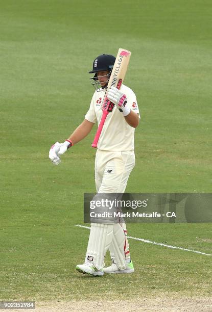 Joe Root of England celebrates and acknowledges the crowd after scoring a half century during day five of the Fifth Test match in the 2017/18 Ashes...