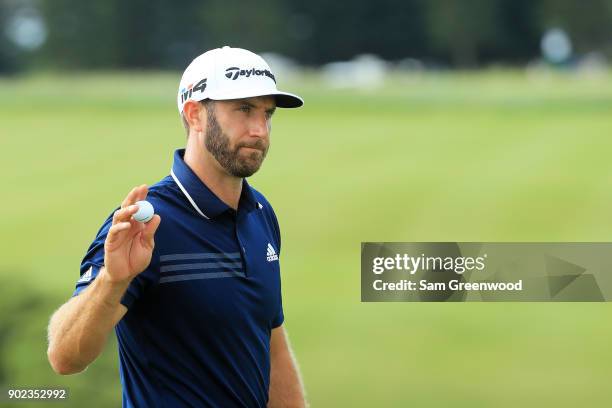 Dustin Johnson of the United States reacts to his birdie on the ninth green during the final round of the Sentry Tournament of Champions at...