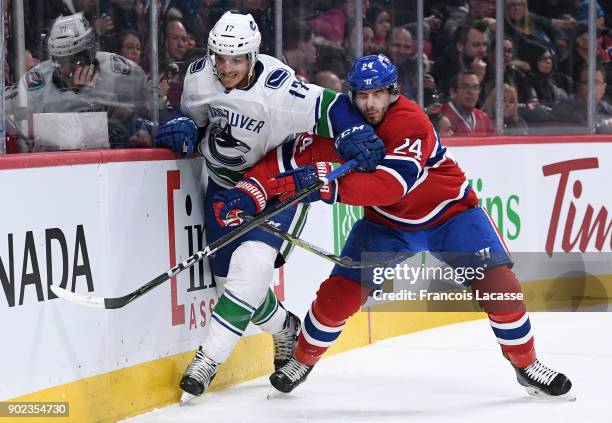 Phillip Danault of the Montreal Canadiens skates against Nic Dowd of the Vancouver Canucks in the NHL game at the Bell Centre on January 7, 2018 in...