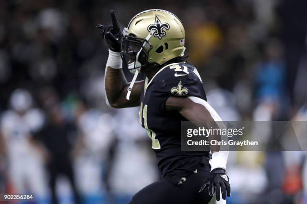 Alvin Kamara of the New Orleans Saints reacts after scoring a touchdown against the Carolina Panthers at the Mercedes-Benz Superdome on January 7,...
