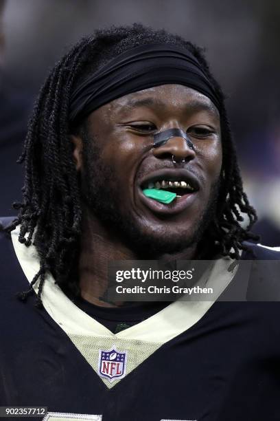 Alvin Kamara of the New Orleans Saints celebrates after a touchdown by eating Airheads candy on the sideline during the game against the Carolina...