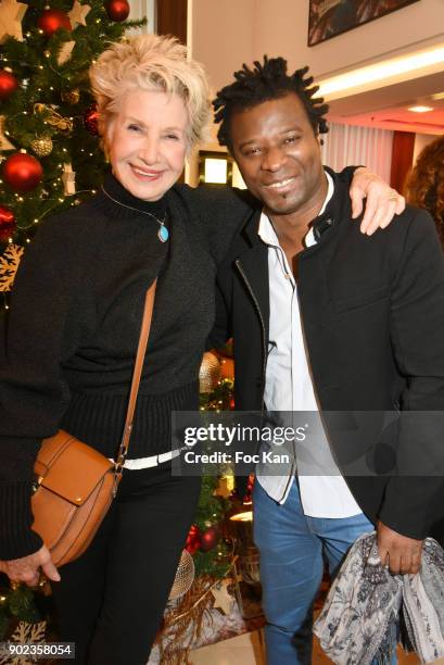 Presenter Daniele Gilbert and rap artist Rostattend 'Heros en Mer' ÊPatrick and Olivier Poivre d'Arvor Book Signing at Hotel Courtyard Mariott...