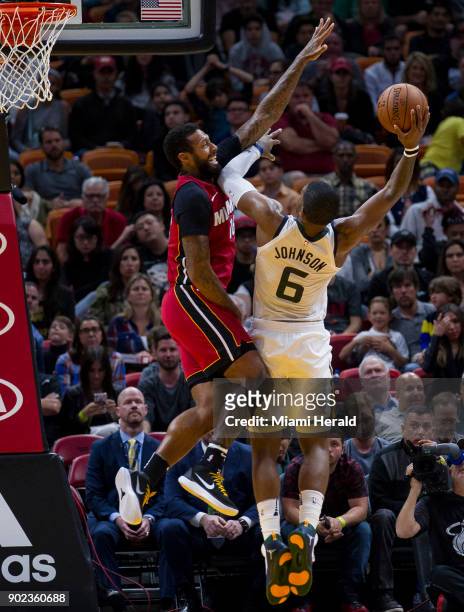 Miami Heat forward James Johnson guards against Utah Jazz's Joe Johnson in the fourth quarter on Sunday, Jan. 7, 2018 at the AmericanAirlines Arena...