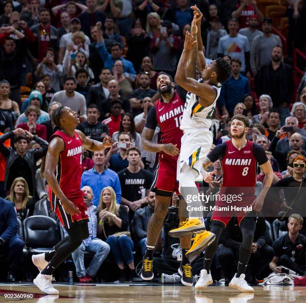 Miami Heat forward James Johnson tries to block Utah Jazz guard Donovan Mitchell's buzzer shot in the last seconds of the fourth quarter on Sunday,...