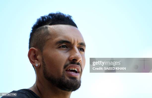 Winner of the men's singles Brisbane International tennis tournament on January 7, Nick Kyrgios of Australia, talks to the media a day after his...