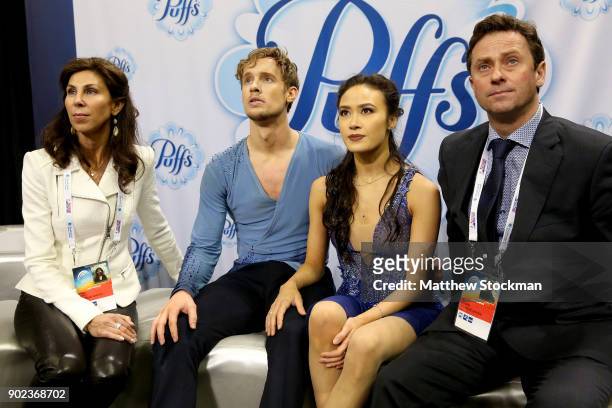Madison Chock and Evan Bates react to their scores in the kiss and cry with their coaches Adrienne Lenda and Igor Shpilband after skating in the Free...