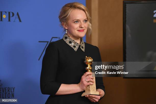 Producer Elisabeth Moss of 'The Handmaid's Tale' poses with the award for Best Television Series Drama in the press room during The 75th Annual...