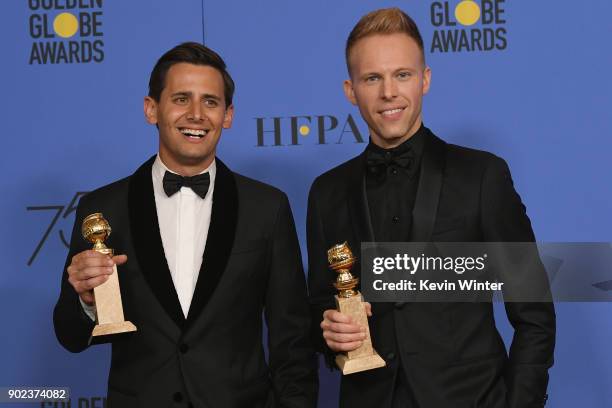 Songwriting duo Benj Pasek and Justin Paul pose with their award for Best Original Song in a Motion Picture for 'This Is Me' from 'The Greatest...