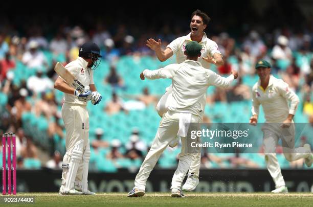 Pat Cummins of Australia celebrates after taking the wicket of Jonny Bairstow of England during day five of the Fifth Test match in the 2017/18 Ashes...