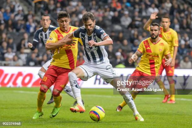 Jose Maria Basanta of Monterrey fights for the ball with Jorge Valadez of Morelia during the first round match between Monterrey and Morelia as part...