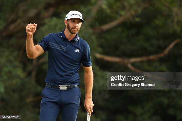 Dustin Johnson of the United States celebrates on the 18th green after winning during the final round of the Sentry Tournament of Champions at...