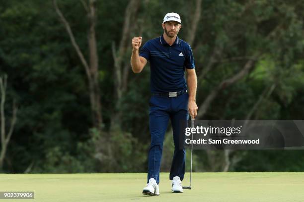 Dustin Johnson of the United States celebrates on the 18th green after winning during the final round of the Sentry Tournament of Champions at...