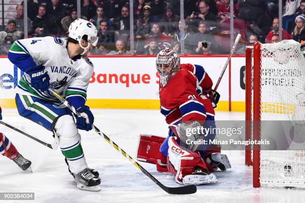 Michael Del Zotto of the Vancouver Canucks scores a third period goal on goaltender Carey Price of the Montreal Canadiens during the NHL game at the...
