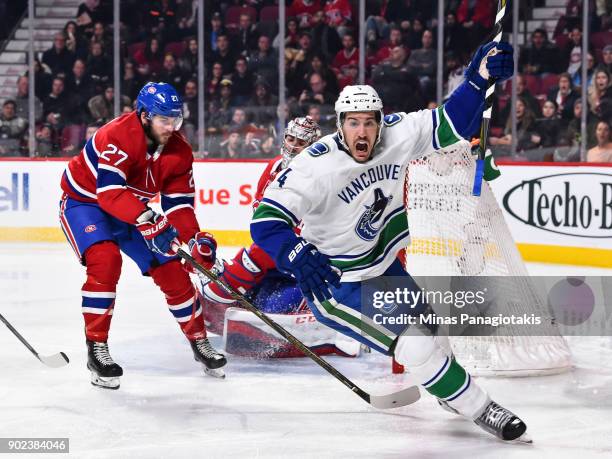 Michael Del Zotto of the Vancouver Canucks reacts after scoring a goal in the third period against the Montreal Canadiens during the NHL game at the...