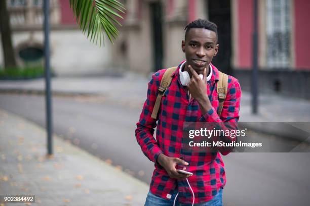 portrait of smiling african teenager - nigeria man stock pictures, royalty-free photos & images