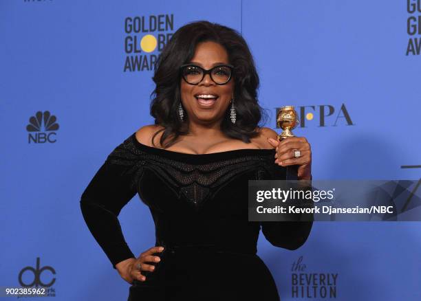 75th ANNUAL GOLDEN GLOBE AWARDS -- Pictured: Oprah Winfrey, recipient of the Cecil B. DeMille Award, poses in the press room at the 75th Annual...