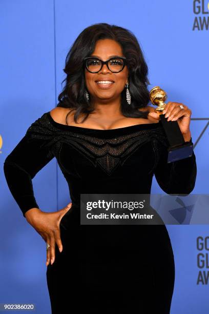 Oprah Winfrey poses with the Cecil B. DeMille Award in the press room during The 75th Annual Golden Globe Awards at The Beverly Hilton Hotel on...