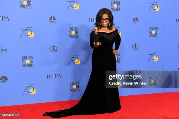 Oprah Winfrey poses with the Cecil B. DeMille Award in the press room during The 75th Annual Golden Globe Awards at The Beverly Hilton Hotel on...