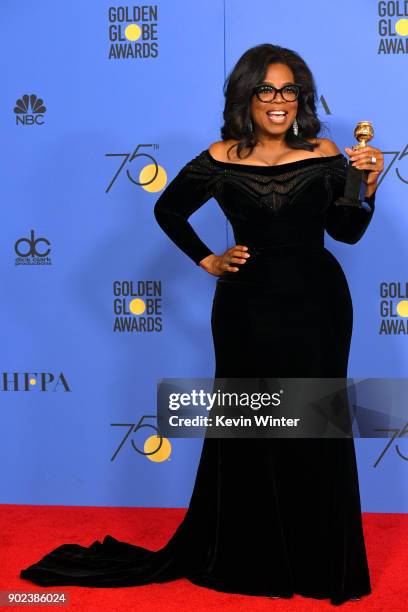 Oprah Winfrey poses with the Cecil B. DeMille Award in the press room during The 75th Annual Golden Globe Awards at The Beverly Hilton Hotel on...