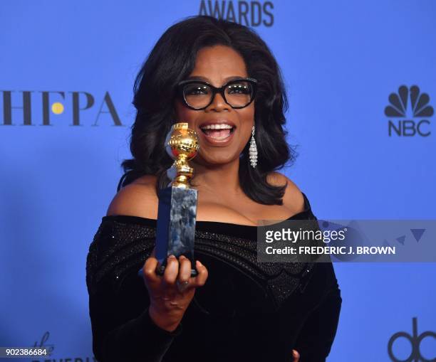 Actress and TV talk show host Oprah Winfrey poses with the Cecil B. DeMille Award during the 75th Golden Globe Awards on January 7 in Beverly Hills,...