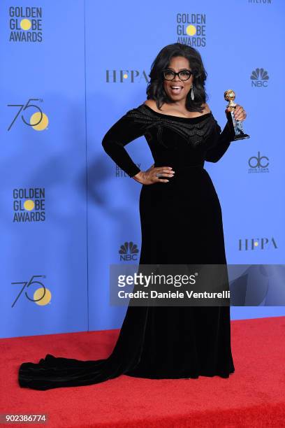 Oprah Winfrey poses with the Cecil B. DeMille Award in the press room during the 75th Annual Golden Globe Awards at The Beverly Hilton Hotel on...
