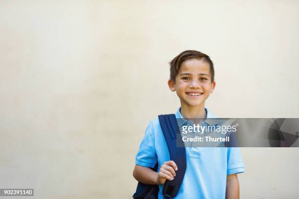 school boy - school uniform stock pictures, royalty-free photos & images