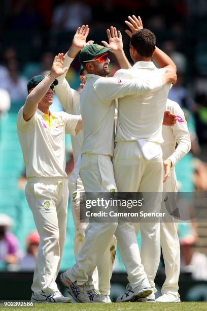 Nathan Lyon of Australia and team mates celebrate winning the fifth test and series during day five of the Fifth Test match in the 2017/18 Ashes...
