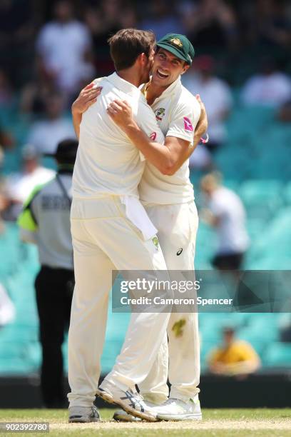 Mitch Marsh of Australia and Pat Cummins of Australia celebrate winning the fifth test and series during day five of the Fifth Test match in the...