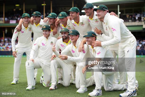 The Australian team celebrate winning the Ashes series with the Ashes trophy during day five of the Fifth Test match in the 2017/18 Ashes Series...