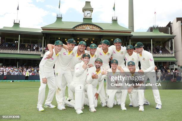 The Australian team celebrate winning the Ashes series with the Ashes trophy during day five of the Fifth Test match in the 2017/18 Ashes Series...