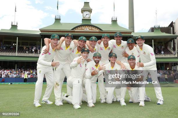 The Australian team celebrate winning the Ashes series with the Ashes trophy during day five of the Fifth Test match in the 2017/18 Ashes Series...