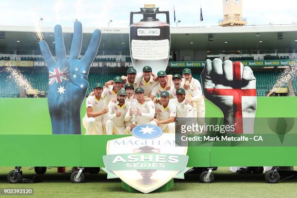 The Australian team celebrate winning the Ashes series with the Ashes trophy during day five of the Fifth Test match in the 2017/18 Ashes Series...