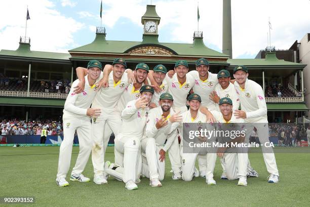 The Australian team celebrate winning the Ashes series with the Ashes trophy during day five of the Fifth Test match in the 2017/18 Ashes Series...