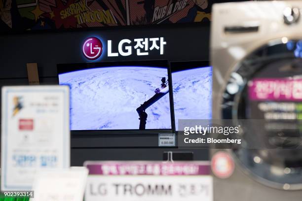 Electronics Inc. Curved organic light-emitting diode televisions are displayed at an E-Mart Inc. Electro Mart store in Gimpo, South Korea, on Friday,...