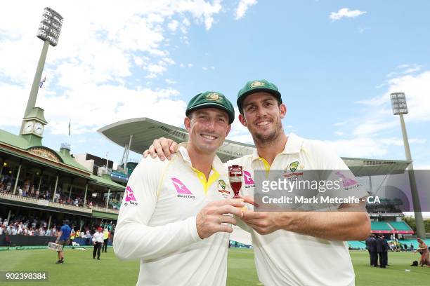 Shaun Marsh of Australia and Mitch Marsh of Australia celebrate winning the Ashes series with a replica urn during day five of the Fifth Test match...