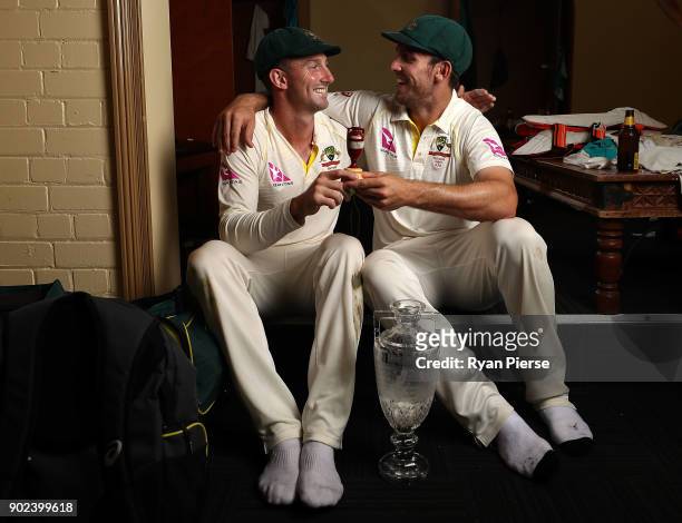 Shaun Marsh and Mitch Marsh of Australia celebrate with the Ashes Urn in the changreooms during day five of the Fifth Test match in the 2017/18 Ashes...