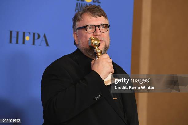 Director Guillermo del Toro poses with the award for Best Director Motion Picture for 'The Shape of Water' in the press room during The 75th Annual...