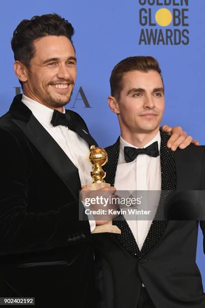 Dave Franco poses with James Francoand his award for Best Performance by an Actor in a Motion Picture Musical or Comedy in 'The Disaster Artist' in...