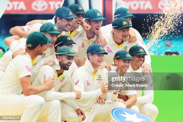 The Australians pose for a team photo after winning the Ashes during day five of the Fifth Test match in the 2017/18 Ashes Series between Australia...