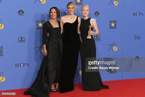 Laurie Metcalf, Greta Gerwig and Saoirse Ronan poses with the award for Best Motion Picture Musical or Comedy in 'Lady Bird' in the press room during...