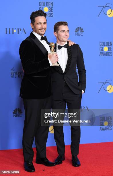 Actor James Franco poses with Best Performance by an Actor in a Motion Picture - Musical or Comedy award for 'The Disaster Artist', with actor Dave...