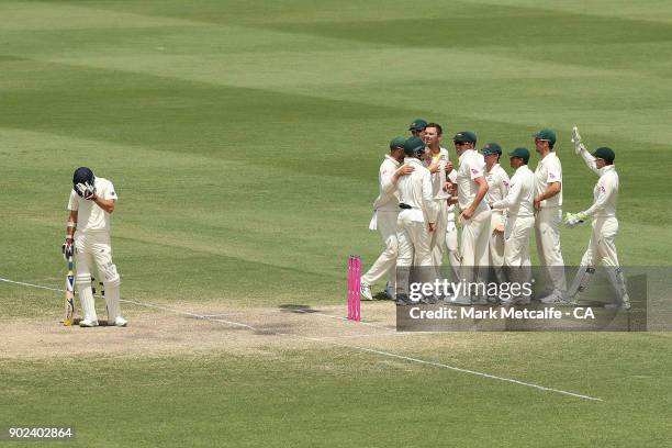 Josh Hazlewood of Australia celebrates with team mates after taking the wicket of James Anderson of England to win the fifth test and series on day...