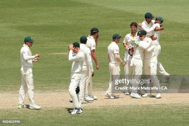 Australian players celebrate winning the fifth test and series on day five of the Fifth Test match in the 2017/18 Ashes Series between Australia and...