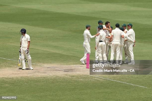 Josh Hazlewood of Australia celebrates with team mates after taking the wicket of James Anderson of England to win the fifth test and series on day...