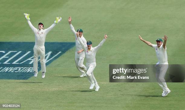 Steve Smith of Australia celebrates with team mates as Australia win the Ashes during day five of the Fifth Test match in the 2017/18 Ashes Series...