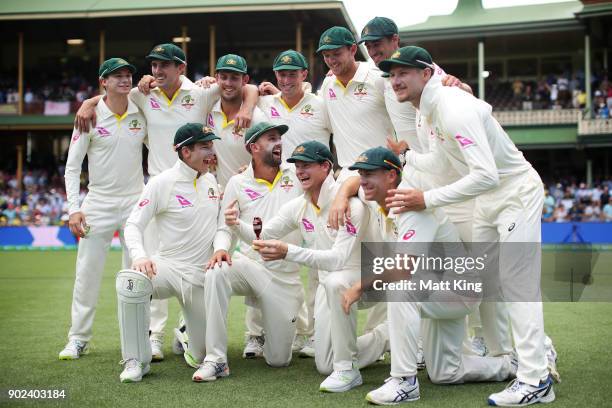 The Australian team celebrate winning the Ashes series with the Ashes trophy during day five of the Fifth Test match in the 2017/18 Ashes Series...