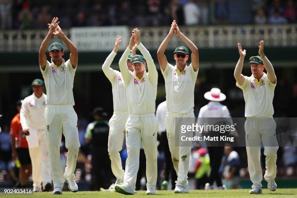 Australian players clap the barmy army after victory during day five of the Fifth Test match in the 2017/18 Ashes Series between Australia and...