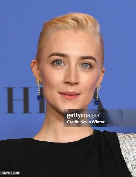 Actress Saoirse Ronan poses with the award for Best Performance by an Actress in a Motion Picture Musical or Comedy in 'Lady Bird' in the press room...